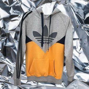 Unisex Adidas hoodie in grey and yellow.
